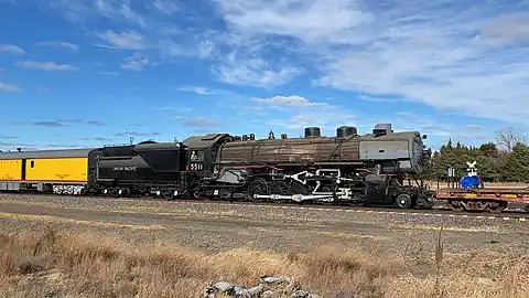 UP 5511 in Brady, Nebraska, being towed to Silvis, Illinois, in November 2022.