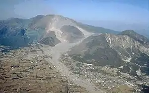 Mount Unzen (center) and Mayuyama (right) showing the destruction, recent photo