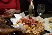 A basket with food on top of a table