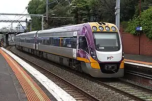 A VLocity train running through South Yarra station.