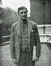 Smartly dressed European man looking towards camera