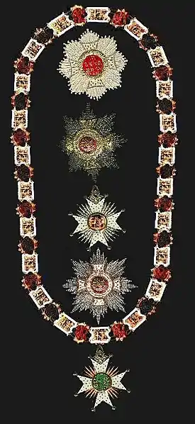 A jeweled chain and three jeweled star-burst medallions.