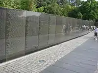 Wall of black granite engraved with names