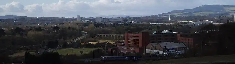 View looking towards Glenrothes from elevated site at St Drostan's Cemetary near Markinch with a view of the town centre skyline, approach roads and railway viaducts