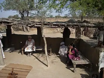 Charpais as daybeds in Rajasthan. Note diamond weave pattern.