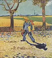 man wearing a straw hat, carrying a canvas and paintbox, walking to the left, down a tree lined, leaf strewn country road