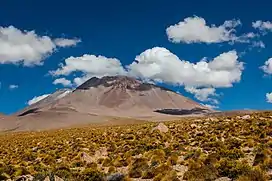 A flat mountain massif over a plain