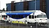 A WES train parked next to the maintenance building. Each of WES's Colorado Railcar-built cars has one streamlined end (on the right in this view) and one non-streamlined end.