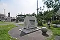 Plaza Dilao marker on the foreground, and Takayama's statue on the background.