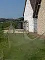 Fishing net drying on poles (reconstruction)