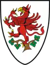 Similarly, the coat of arms of Greifswald, Germany, in Mecklenburg-Vorpommern, also shows a red griffin rampant – perched in a tree, reflecting a legend about the town's founding in the 13th century.