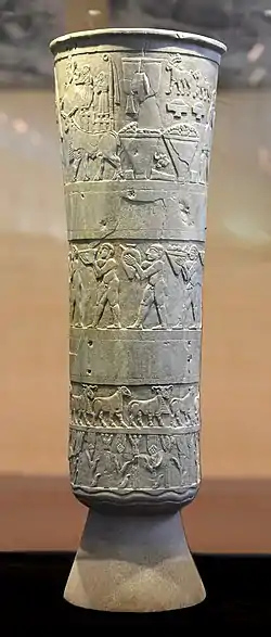 The Warka Vase of Sumer, a very early survival works of narrative relief, c. 3200–3000 BC. Alabaster. National Museum of Iraq.