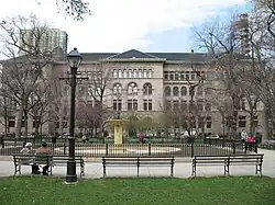 Washington Square Park is pictured with Newberry Library in the background.