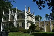 Wedding Cake House (Kennebunk, Maine). Example of a house built in an older style modified in the Carpenter Gothic style in the mid-1800s.