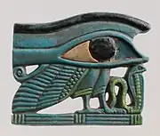 Wedjat amulet with a cobra and the wing and legs of a bird