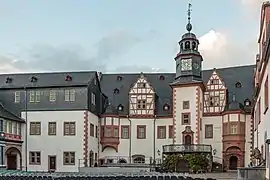 The same east wing from inside the Renaissance courtyard, with clocktower