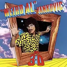 The cover for "Weird Al" Yankovic in 3-D shows "Weird Al" Yankovic protruding out of an askew box with a wooden frame. The title is written in mock three-deminsional font.