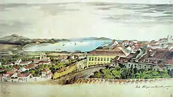 Watercolor depicting a scene overlooking a hillside on the slopes of which are many houses, and in the distance, ships at anchor in a wide river bordered by hills