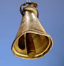 An improvised cowbell used for sheep or goats. The bell was found in 1988 in a field near Tuqu' (Tekoa) in the Judean hills, the West Bank. The bell's body is made of aluminum, probably a broken kitchen utensil, while the clapper is a brass cartridge case.