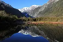 A view across Peters Pool toward the Franz Josef / Kā Roimata o Hine Hukatere