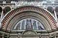 The tympanum at Westminster Cathedral showing Christ in Majesty with the Virgin Mary and Saints; a mosaic by Robert Anning Bell after drawings by John Francis Bentley, 1916