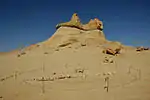 A whale skeleton lies in the sand at Wadi Al-Hitan (Arabic: وادي الحيتان, ‘Whale Valley’) near the city of Faiyum