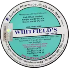 Circular design with green/turquoise and white backgrounds. The text 'Whitfield's ointment' in the centre and other text about ingredients and instructions placed in the green sections.