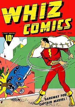 Comic-book cover with a caped, red-costumed Captain Marvel throwing a car into a wall