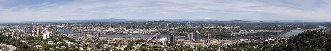 The bridges, from right to left, are the Sellwood, Ross Island, Marquam, Hawthorne, Morrision, Burnside, Steel (the black bridge that is partially obscured), Fremont (the arch bridge at far left). The mountains, from right to left, are Mount Hood, Mount Adams (only the tip is visible) and Mount Saint Helens.