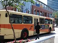 an orange Winnipeg Transit bus in service.