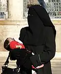 A woman wearing a niqab with gloves in Syria, 2010