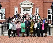 Members of the Women's Legislative Caucus of Maryland stand on the steps outside of the Governor's House