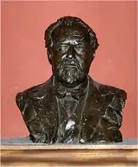 metal bust of an elderly man with moustache, beard and receding hair