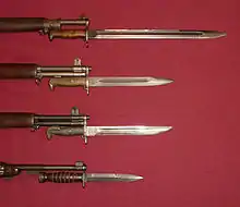 US military bayonets; from the top down, they are the M1905, the M1, M1905E1 Bowie Point Bayonet (a cut down version of the M1905), and the M4 Bayonet for the M1 Carbine. The top 3 blades each have fullers