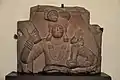 Yaksha holding a mudgar mace and a child. 100 BCE.