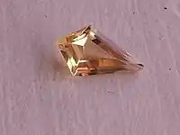 Yellow topaz in stepped kite-shaped cut