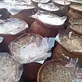 Sweet Yoghurt, made and contained in pots of clay are kept for sale, Bangladesh.