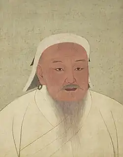 A head-shot style painting of a middle aged to older middle aged man with small eyes and eyebrows, but a long, grey beard and a thick grey mustache. He is wearing white robes and a white cap that folds over the head and hangs loosely at the back.