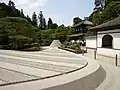 The Zen rock garden of Ginkaku-ji features a miniature mountain shaped like Mount Fuji.