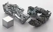 Zinc fragments and a 1 cm3 cube