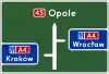 E-1b "pre-signpost board, before the motorway entrance"