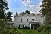 Southern portion of east elevation, part of the two-story white house