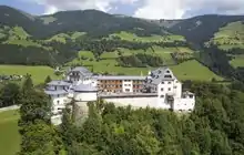 A large castle on the top of a hill