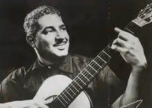 Photograph of Dorival Caymmi with a guitar in 1956