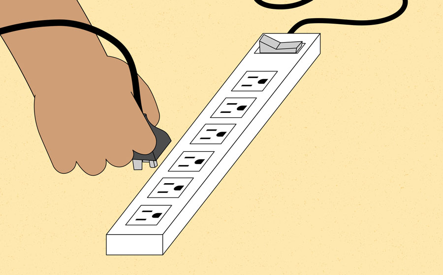 plugging the computer into the surge protector